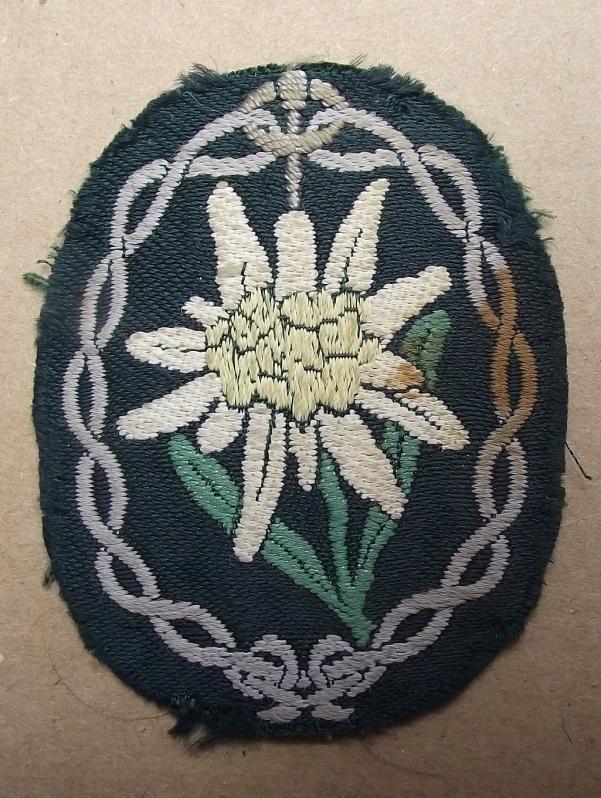 Mountain Troopers Edelweiss Bevo Arm Badge.