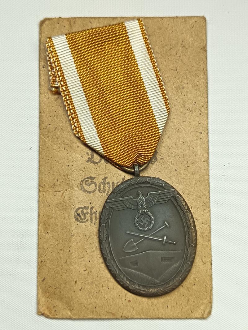 WW2 German West Wall Medal and Paper Packet.