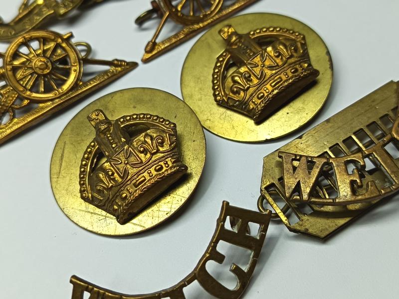 RA and Welch Regiment Brass Insignia.