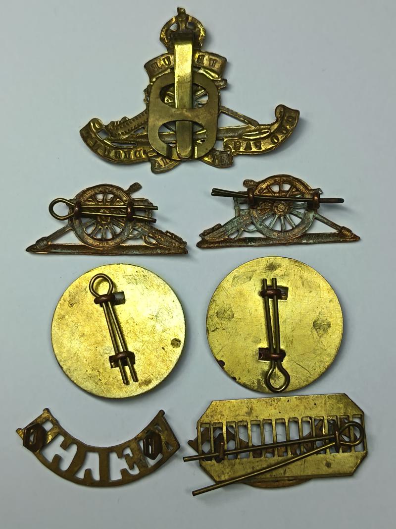 RA and Welch Regiment Brass Insignia.