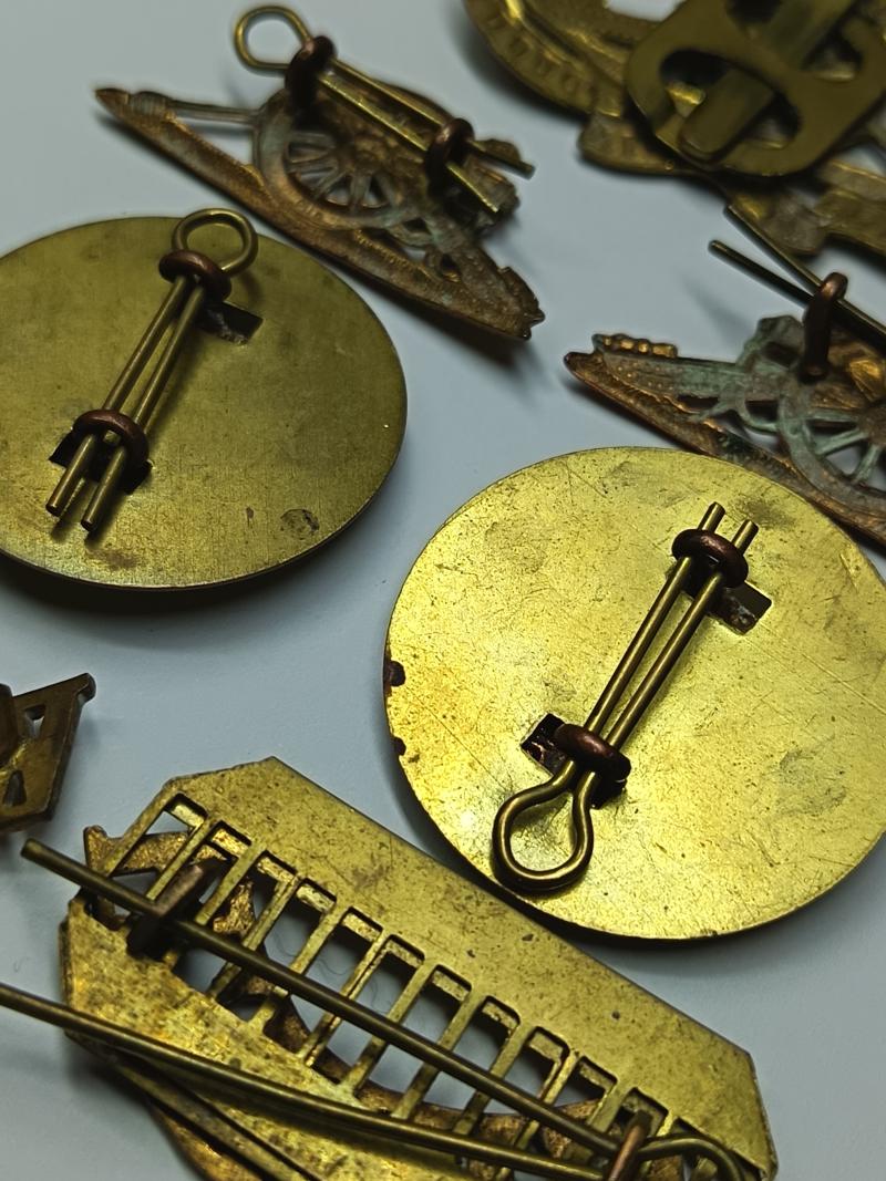 RA and Welch Regiment Brass Insignia.