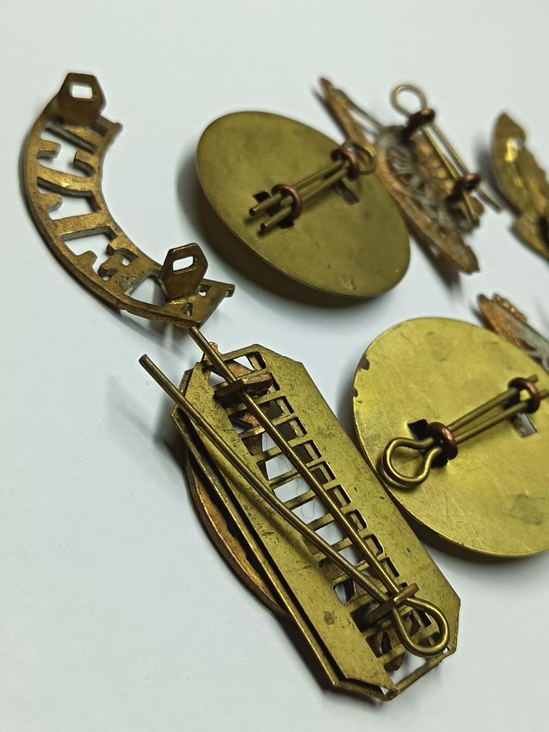 RA and Welch Regiment Brass Insignia.